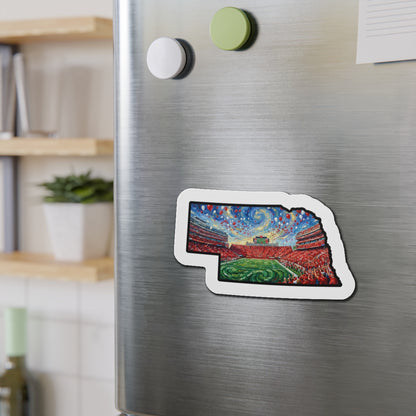Fridge magnet shaped like a stadium on a metallic refrigerator with a blurred indoor background
