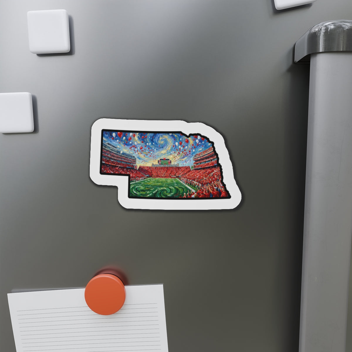 Colorful magnet shaped like a stadium on a refrigerator