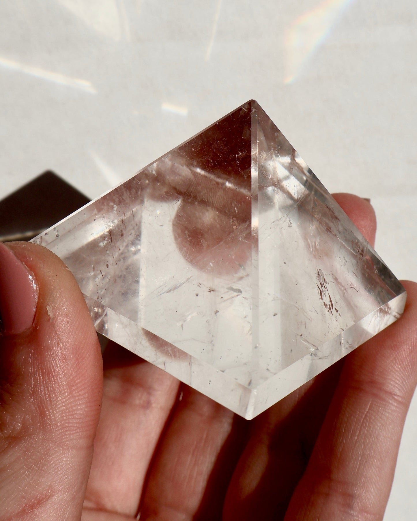glimmering Clear Quartz Pyramid in lighting effect