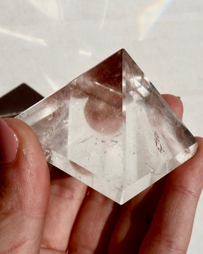 glimmering Clear Quartz Pyramid in lighting effect