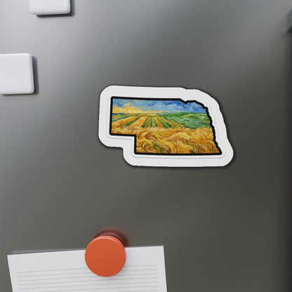 Fridge magnet shaped like a stylized map of Nebraska on a refrigerator.