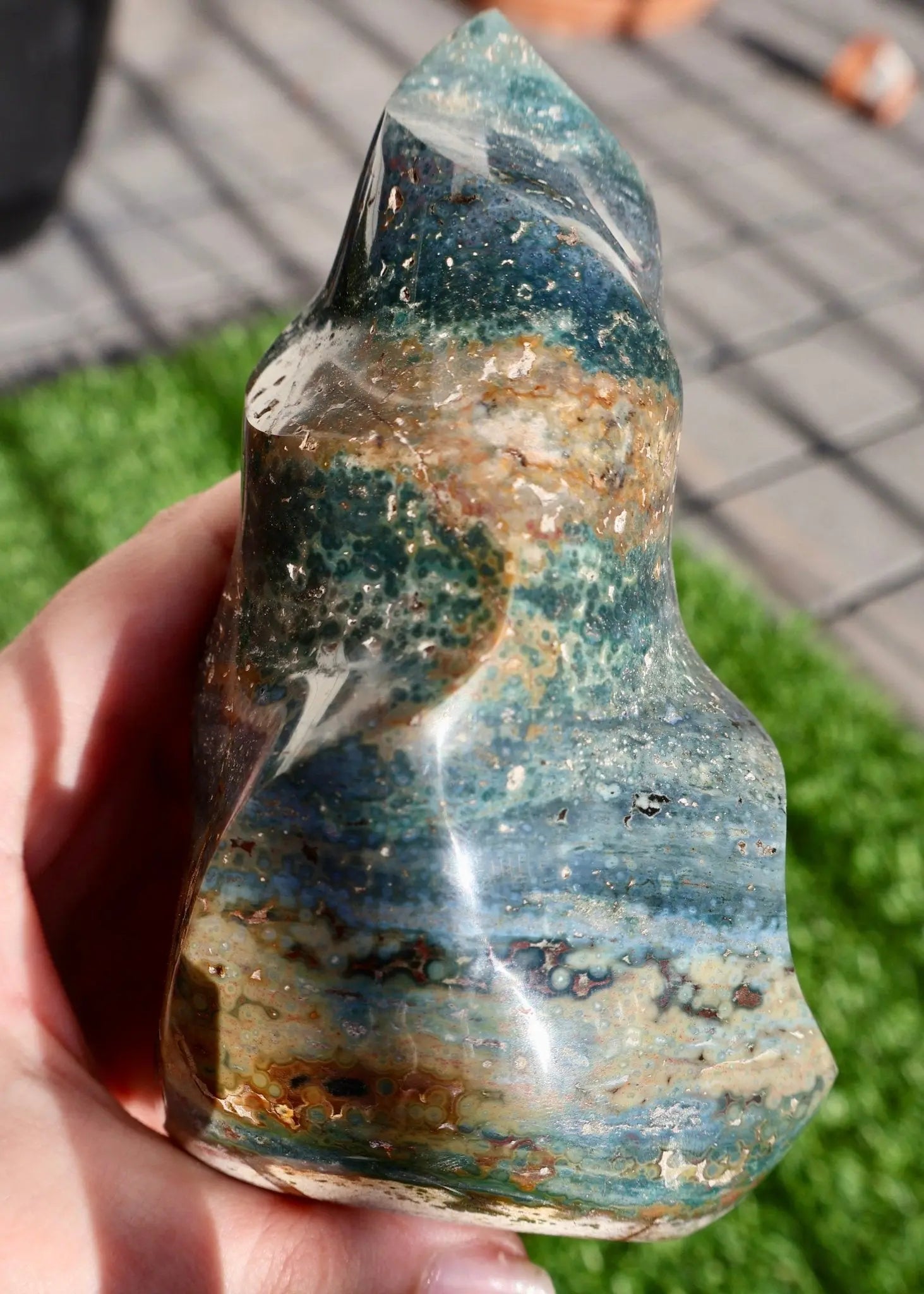 textured Ocean Jasper Crystal Flame, Hand Carved Decorative Sculpture, Multicolor 5-6" in angled view